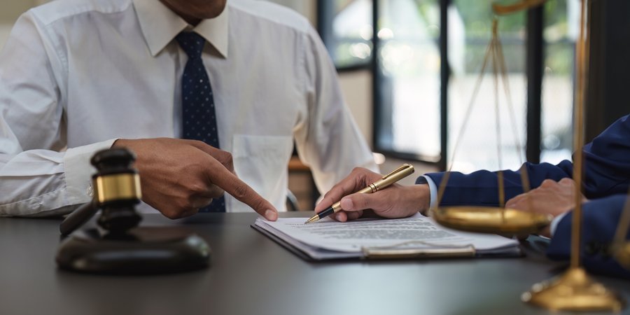 business-people-and-lawyers-discussing-contract-pa-2023-01-30-01-24-23-utc.jpg